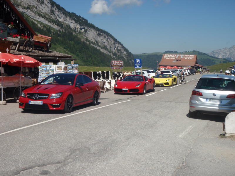 Show-off cars on the Aravis pass. The road is not in good condition, the Ferrari and the Lambo were scraping the ground